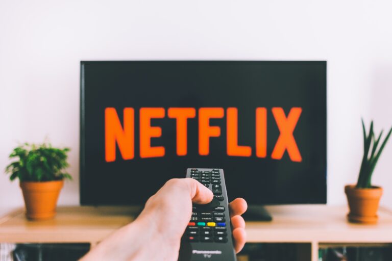 A person browses the Netflix startup screen on their connected TV device.